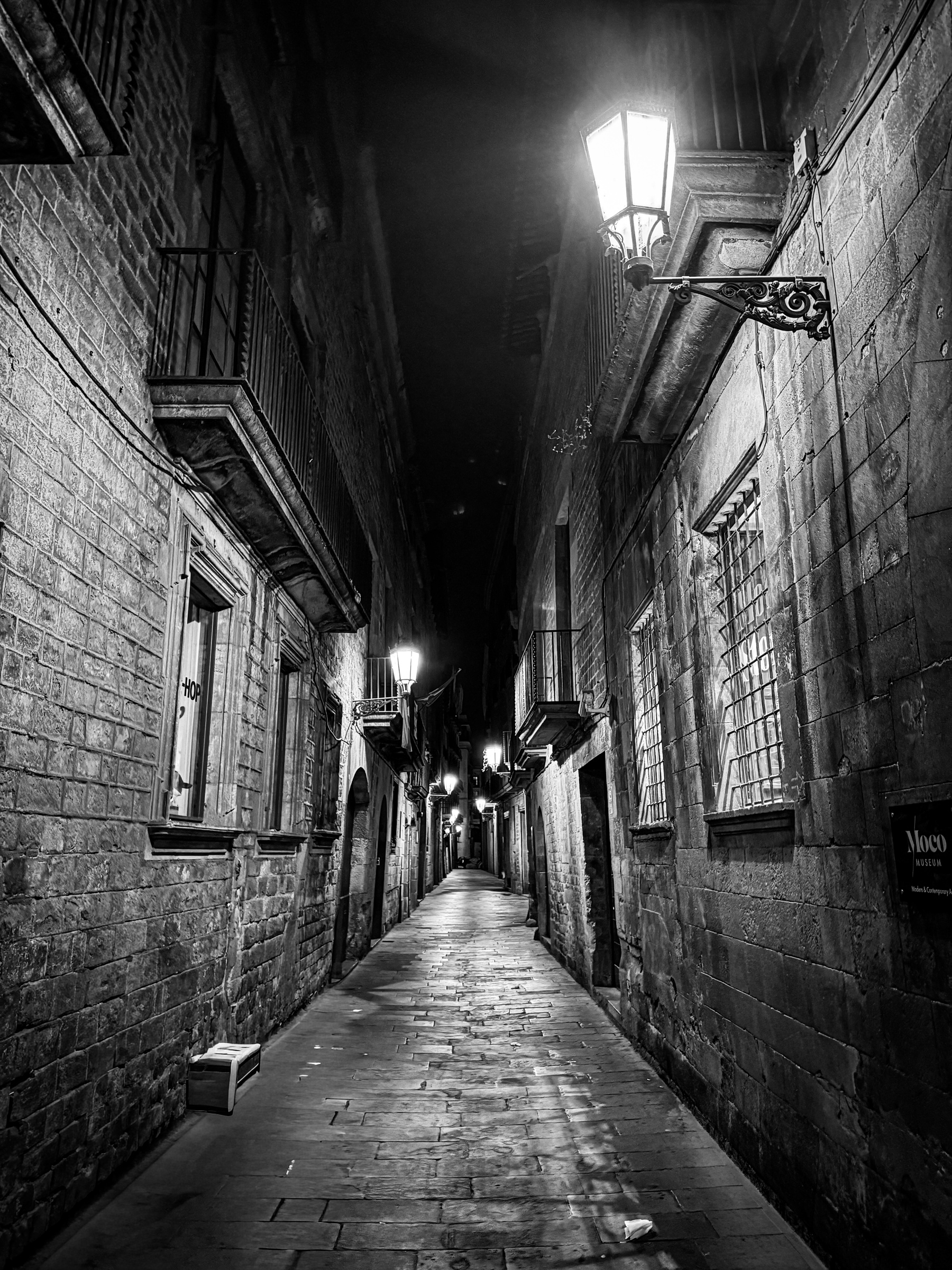 Gothic quarter alley with street lamps