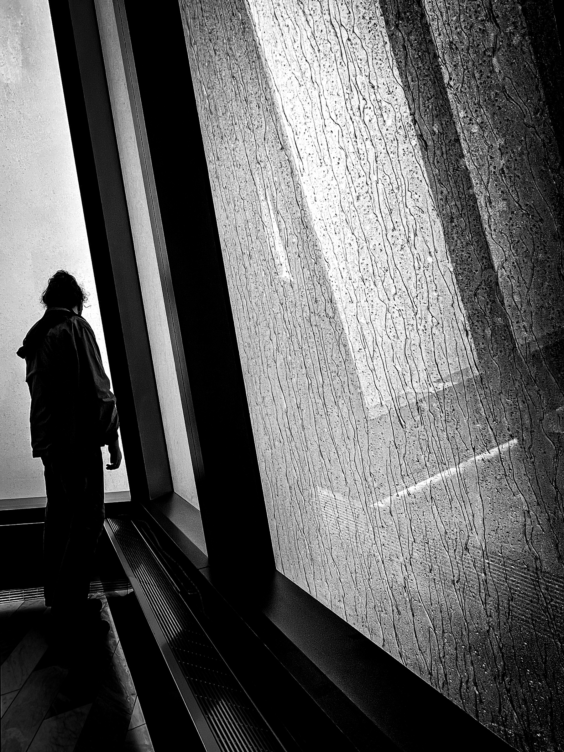 Gavin looking out highrise window