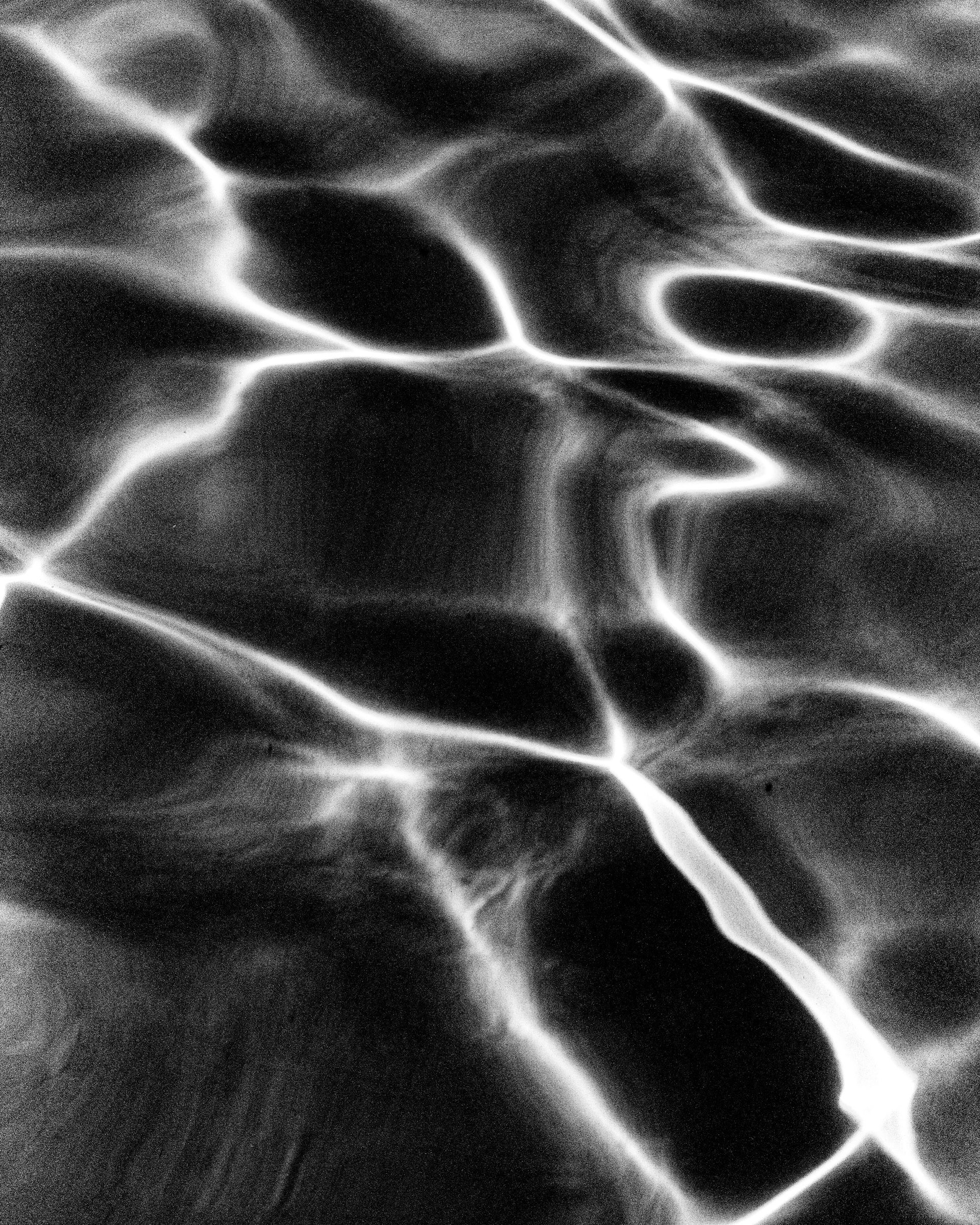 Abstract water surface caustics, light patterns on pool water — Palm Desert, California