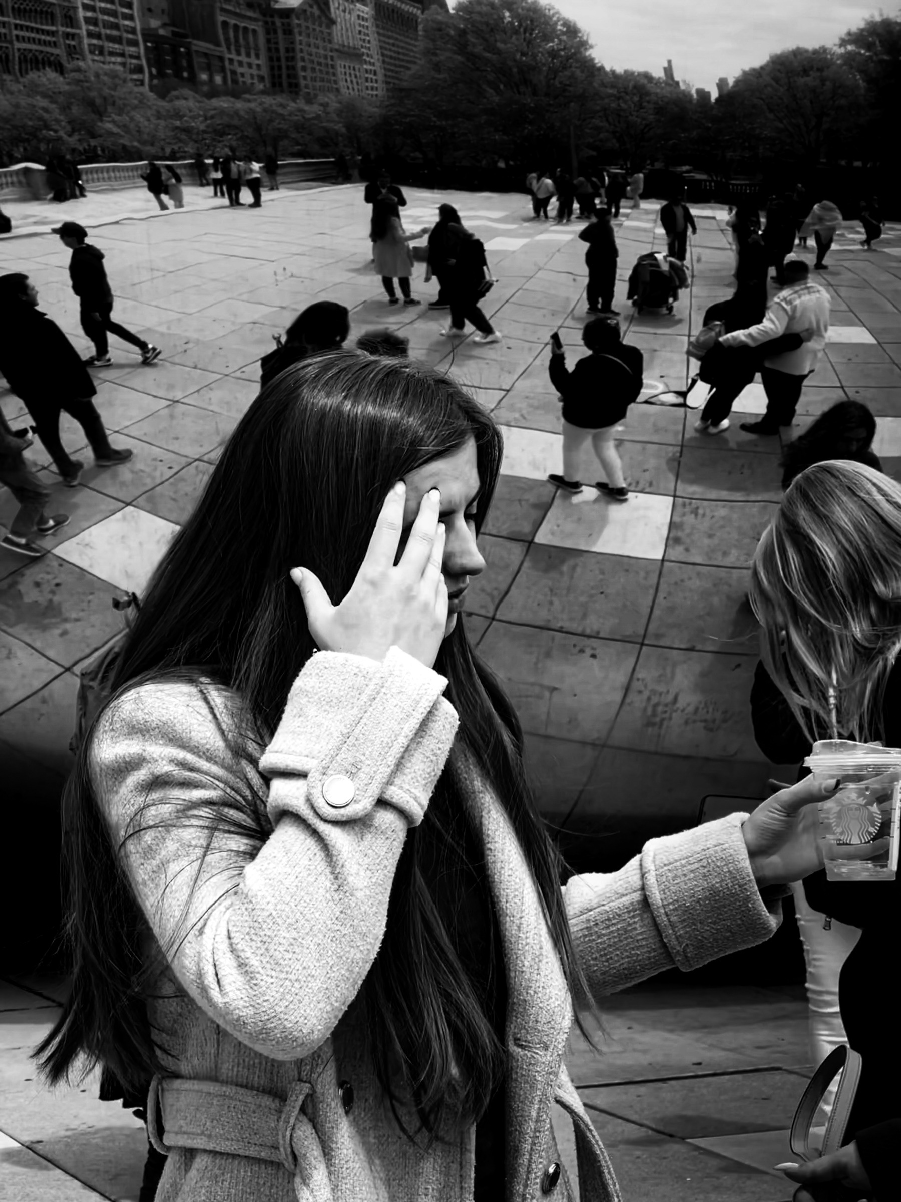 Iyla brushing hair in front of the Bean
