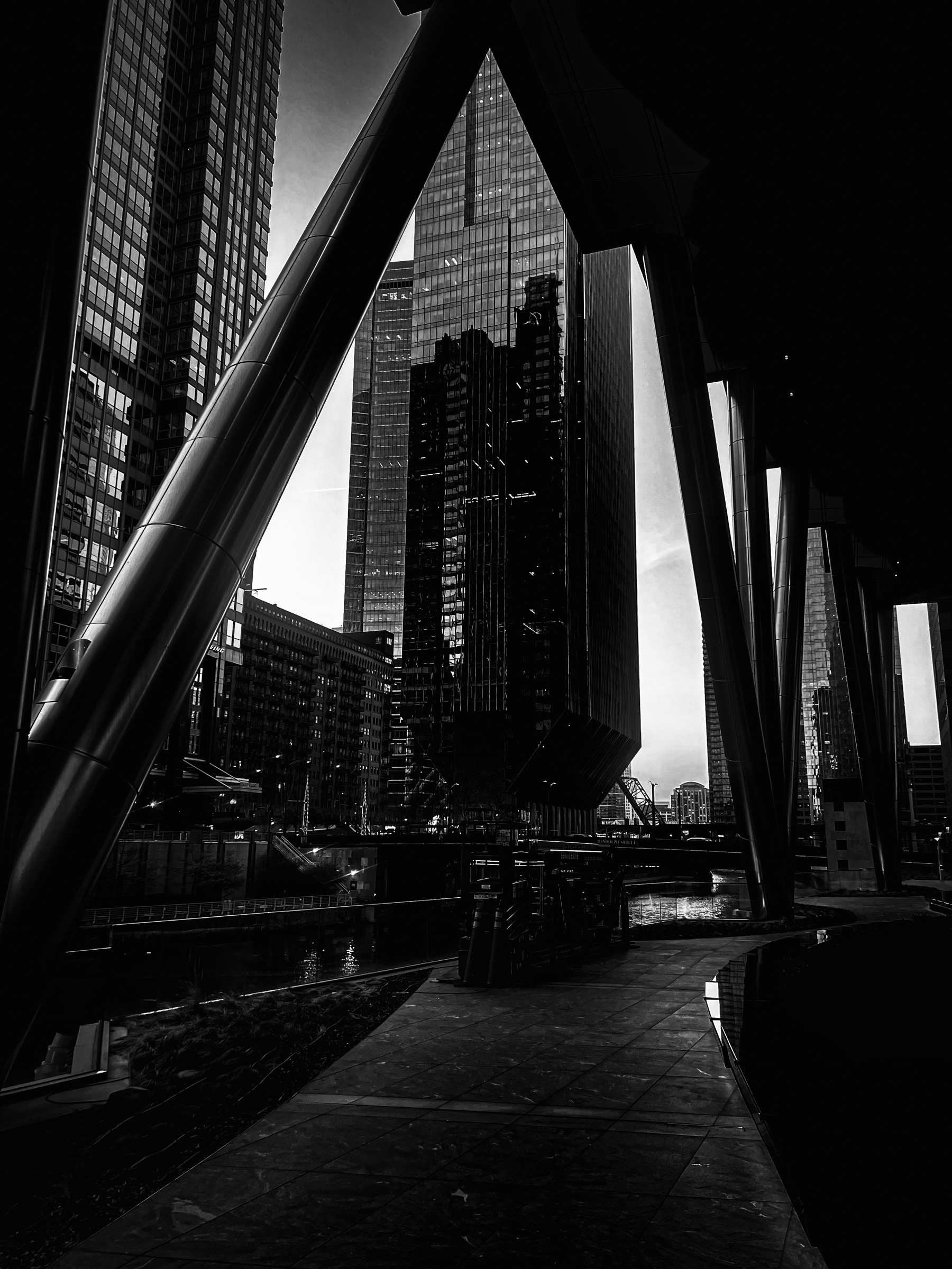 View of highrise across river under rafters
