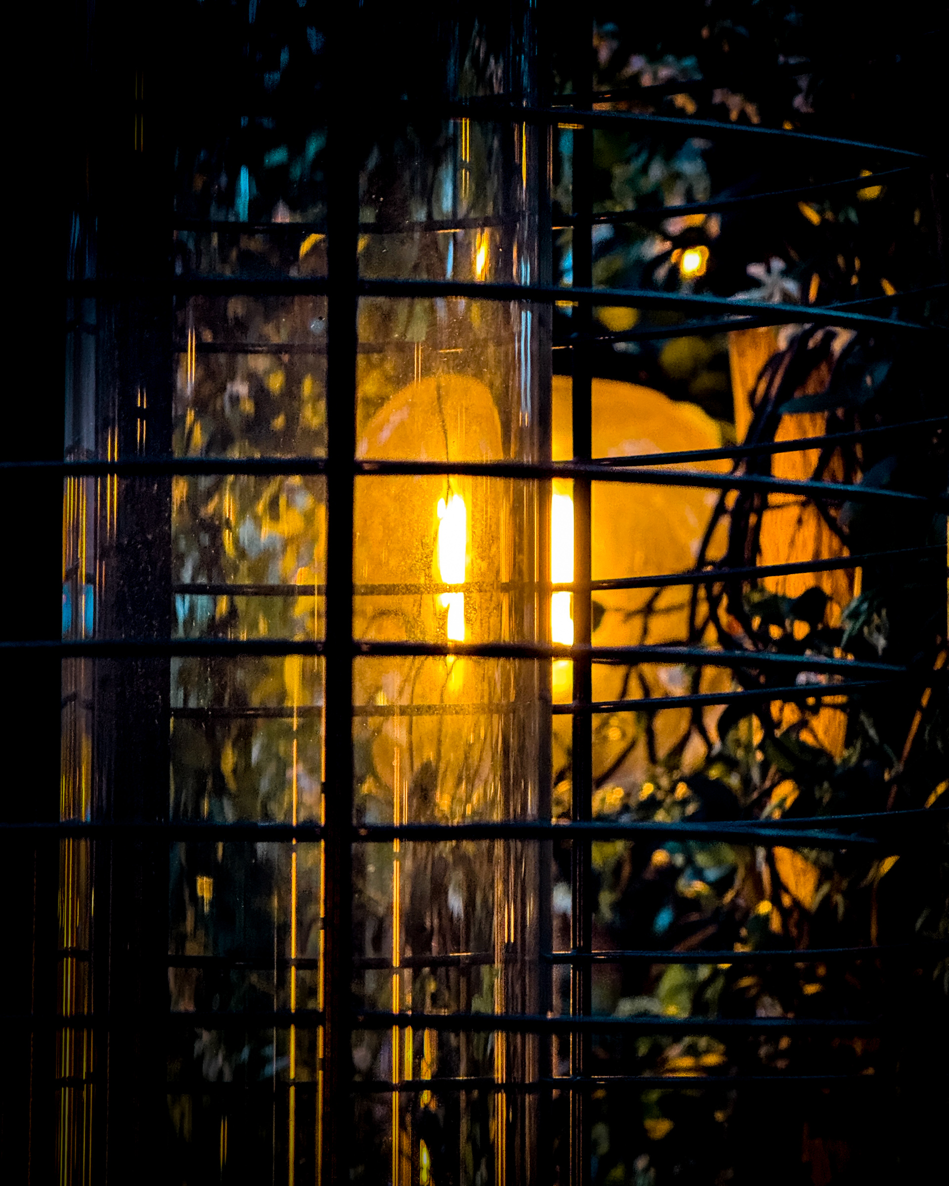 Lamp illuminating a gas fire heater at Berenjak SoHo in Los Angeles, CA — Color
