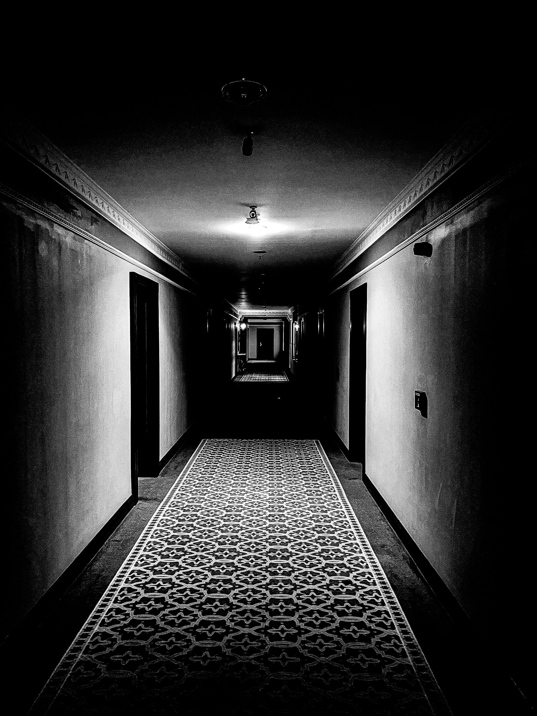 Long hotel corridor receding into darkness — Istanbul, Turkey