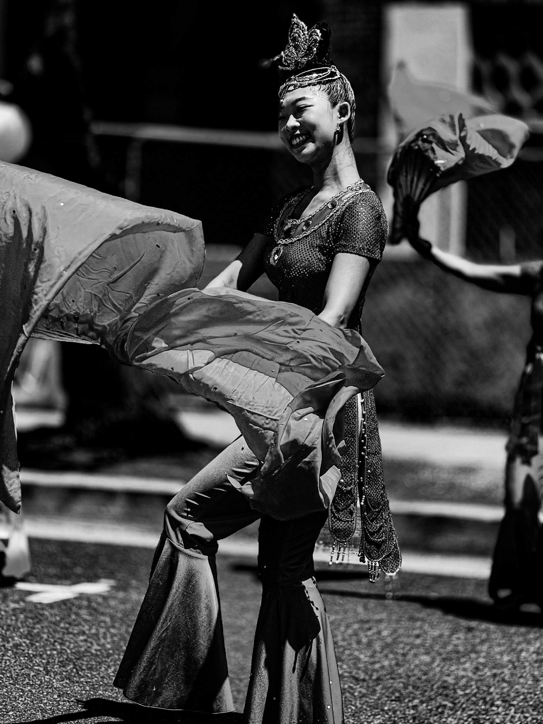 Young woman carrying a flag in the Rose Parade — Pasadena, California