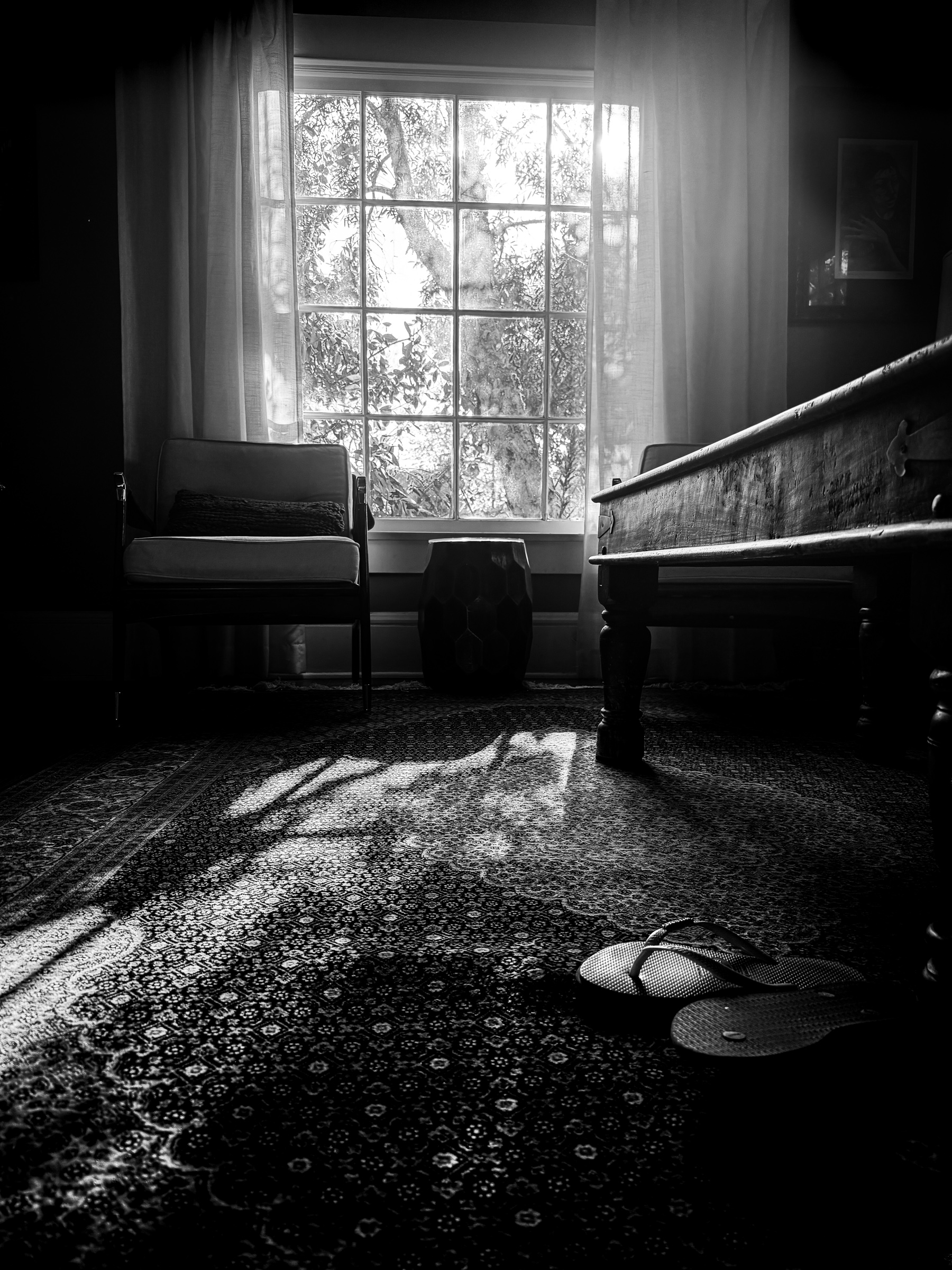 Afternoon light filtering through a living room window with flip flops in foreground — South Pasadena, California