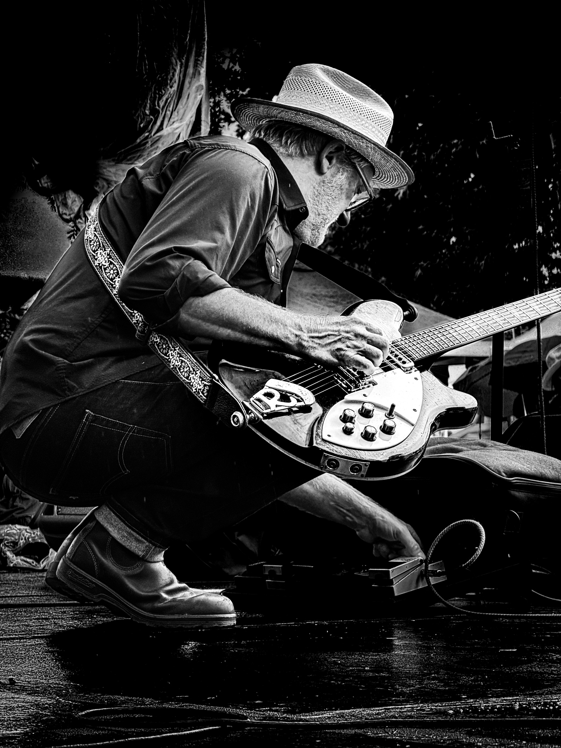Band guitarist setting up on stage during the Art Crawl — South Pasadena, California
