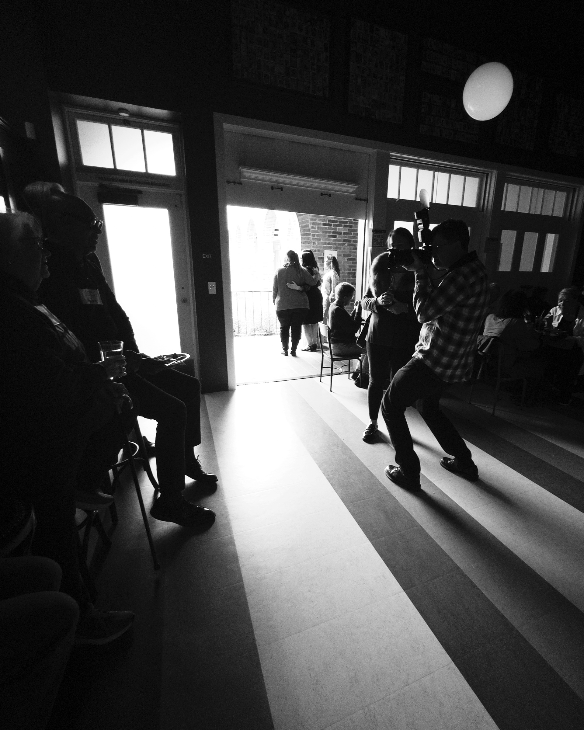 Photographer at work in Sid the Cat Auditorium Bar — South Pasadena, California